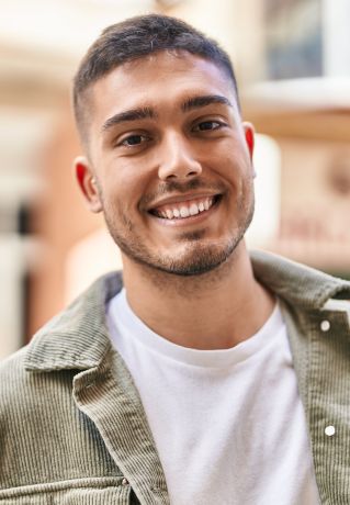 Teacher and students engaged in a creative school project indoors.
