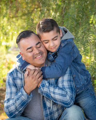 Teacher and students engaged in a creative school project indoors.